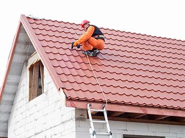 Man installing a New Roof in Haltom City, Irving, Fort Worth, Burleson, Weatherford, and Surrounding Areas